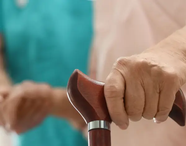 Holding a walking stick